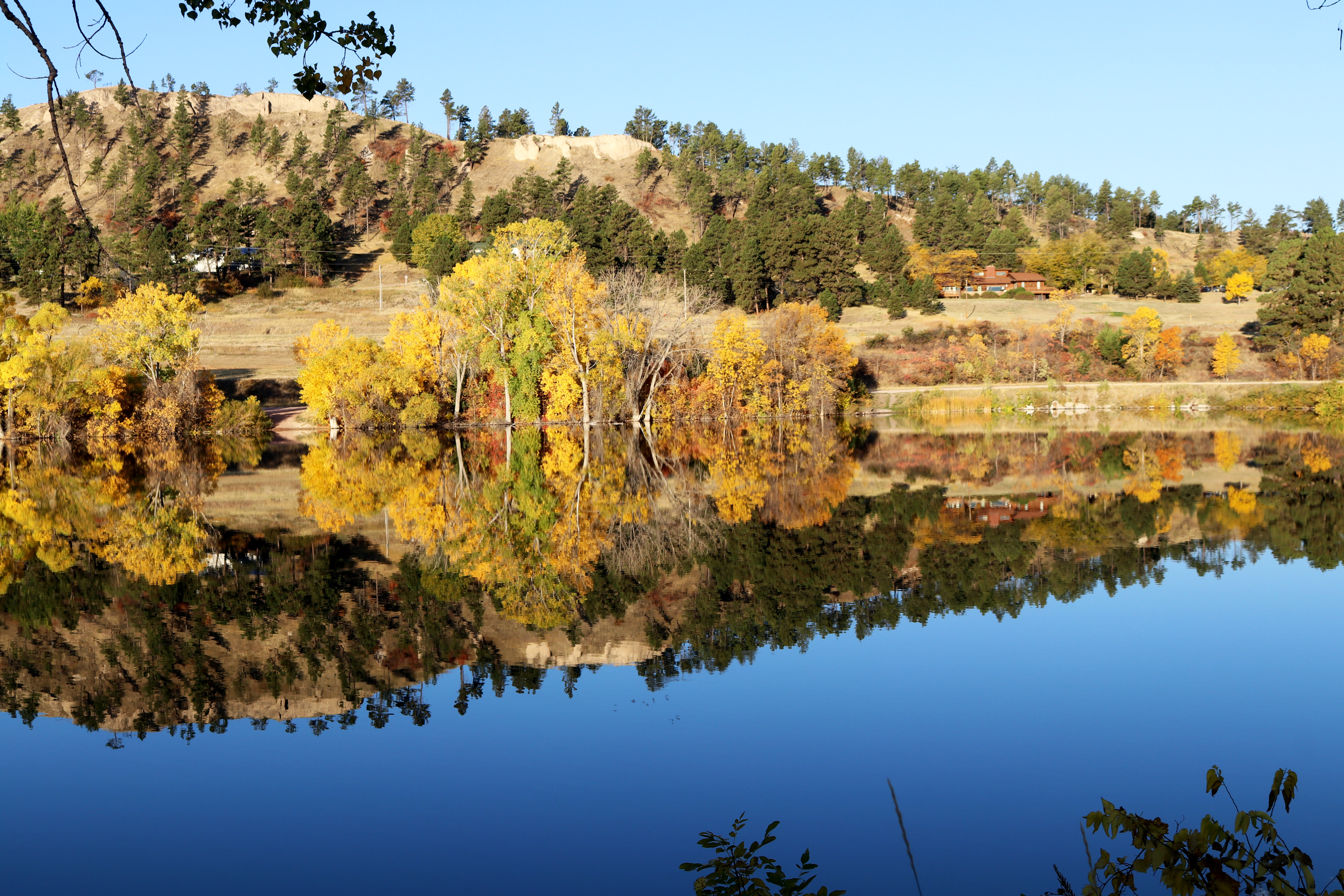 Photo of Chadron City Dams with trees in fall colors