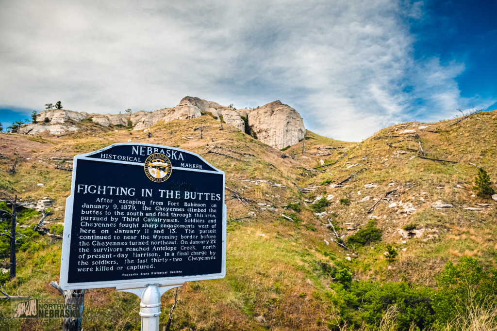 Cheyenne Outbreak state historical marker with buttes in the background