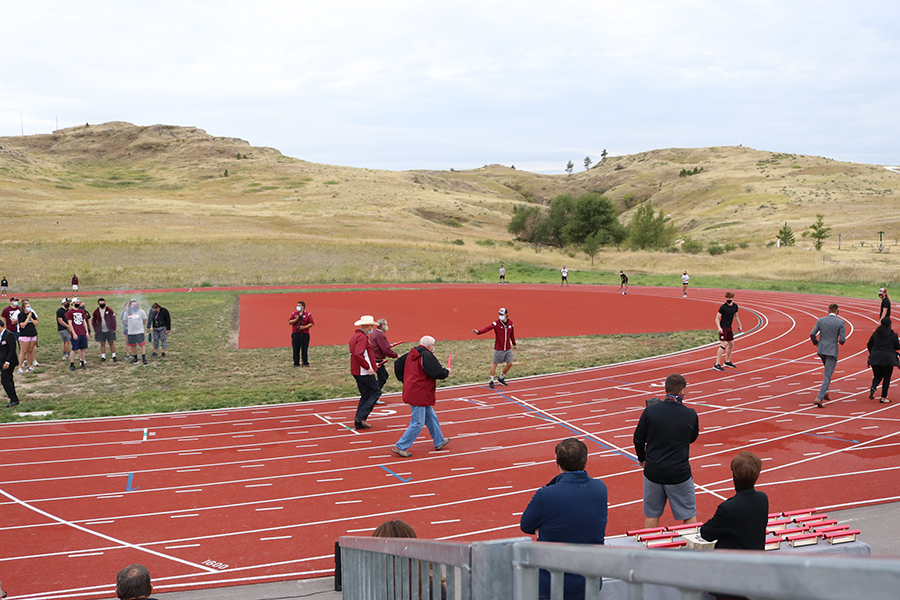 People run on the Chadron State College track.